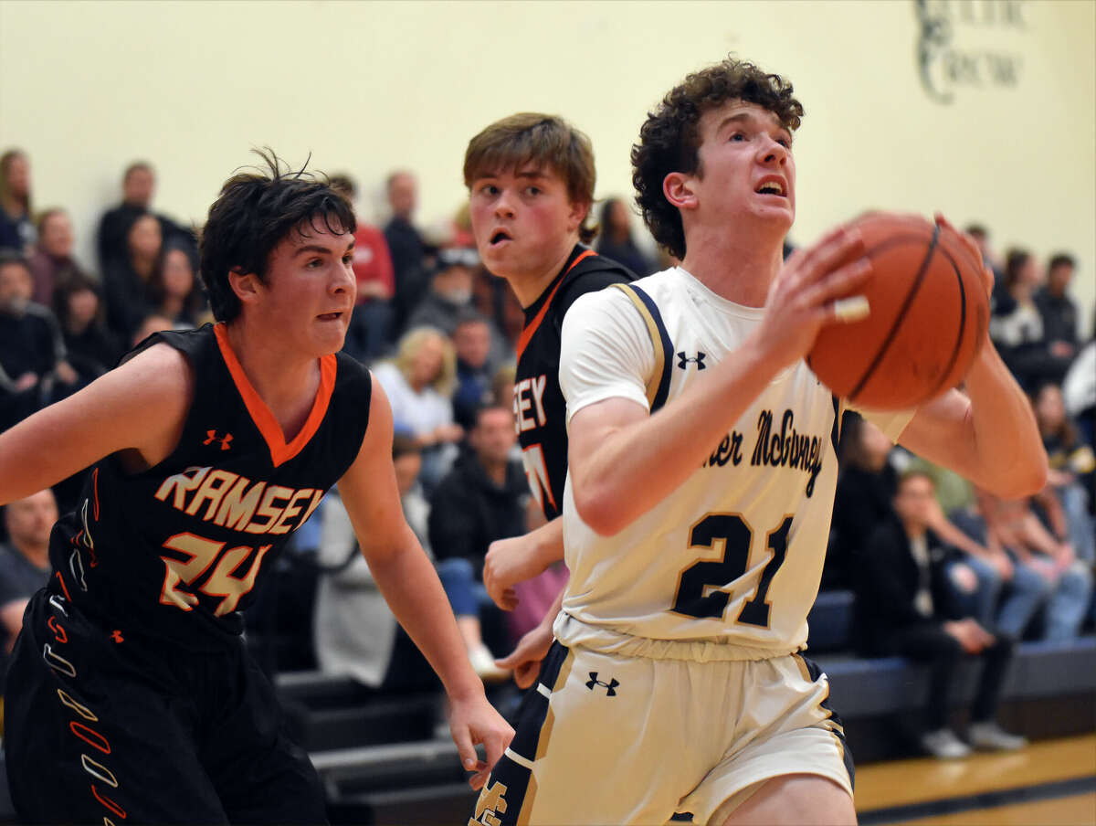 Father McGivney's Ryker Keller goes up a shot against Ramsey in Glen Carbon.