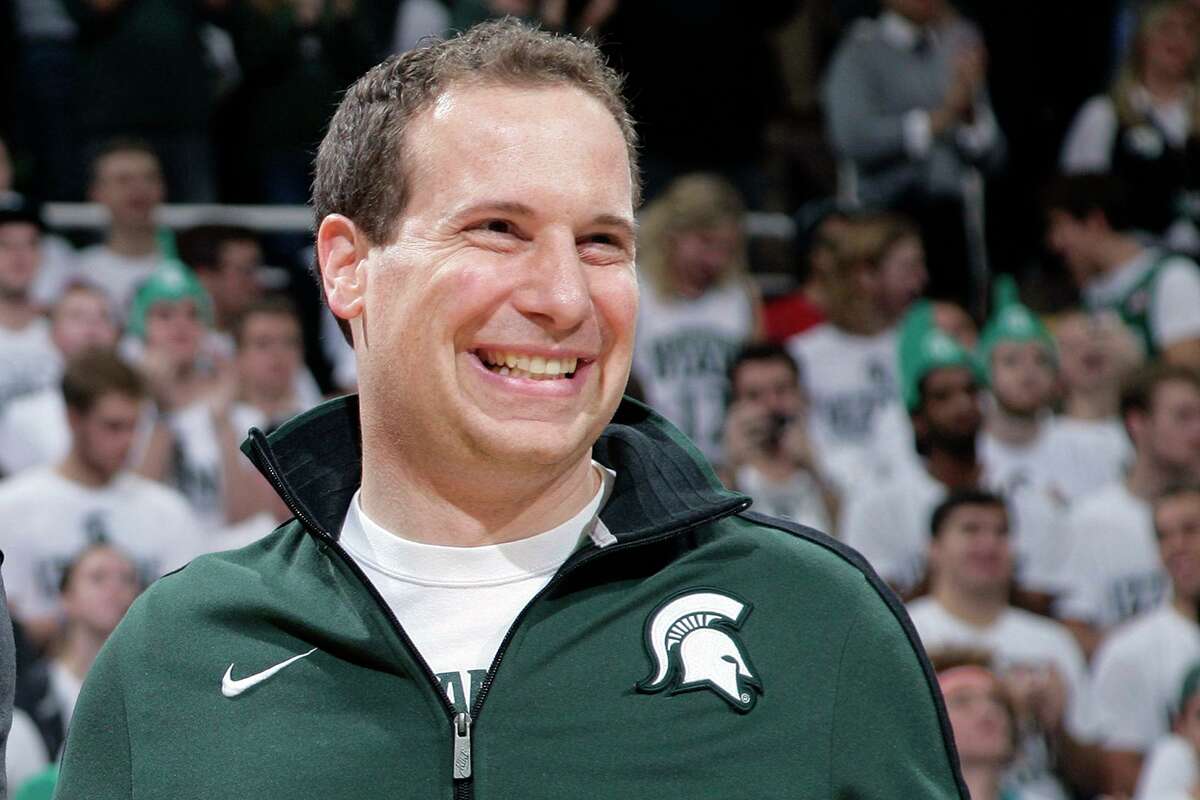 FILE -Former Michigan State player Mat Ishbia laughs as he are introduced along with Michigan State's 2000 national championship NCAA college basketball team during halftime of the Michigan State-Florida game in East Lansing, Mich. Mortgage executive Mat Ishbia has agreed in principle to buy the Phoenix Suns and Phoenix Mercury from the embattled owner Robert Sarver for $4 billion, a person with knowledge of the negotiations told The Associated Press on Tuesday, Dec. 20, 2022. (AP Photo/Al Goldis, File)