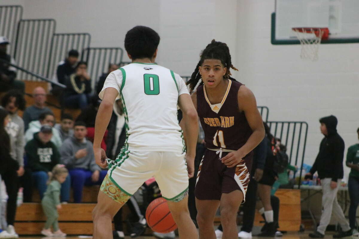 Deer Park guard Malachi Martinez-Miller brings the ball up the floor against the defense of Hector Manriquez.