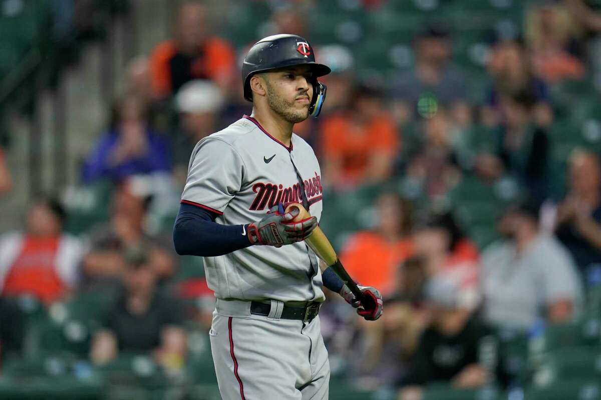 FILE - Minnesota Twins' Carlos Correa heads to the dugout after striking out swinging against Baltimore Orioles starting pitcher Tyler Wells during the fourth inning of a baseball game, Monday, May 2, 2022, in Baltimore. The San Francisco Giants postponed a news conference Tuesday to introduce Carlos Correa after a medical concern arose during the All-Star shortstop's physical, according to two people with direct knowledge of the situation.(AP Photo/Julio Cortez, File)