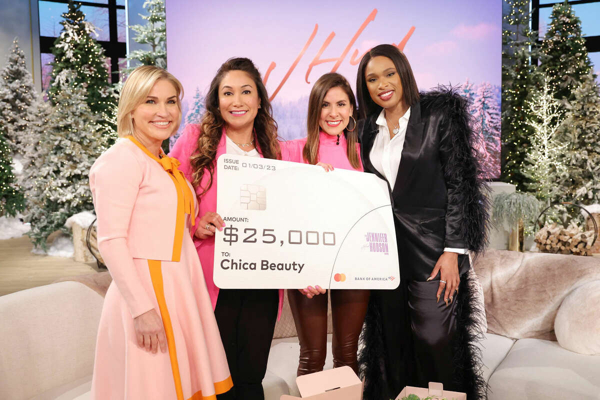 Bank of America's President of Small Business Sharon Miller (left) joined sisters and entrepreneurs Mei-Lon Jimenez and Toni Jimenez (center) to surprise them with a $25,000 grant for their San Antonio-based cosmetics line, Chica Beauty, with actress and singer Jennifer Hudson on "The Jennifer Hudson Show." The episode aired Dec. 16, 2022.