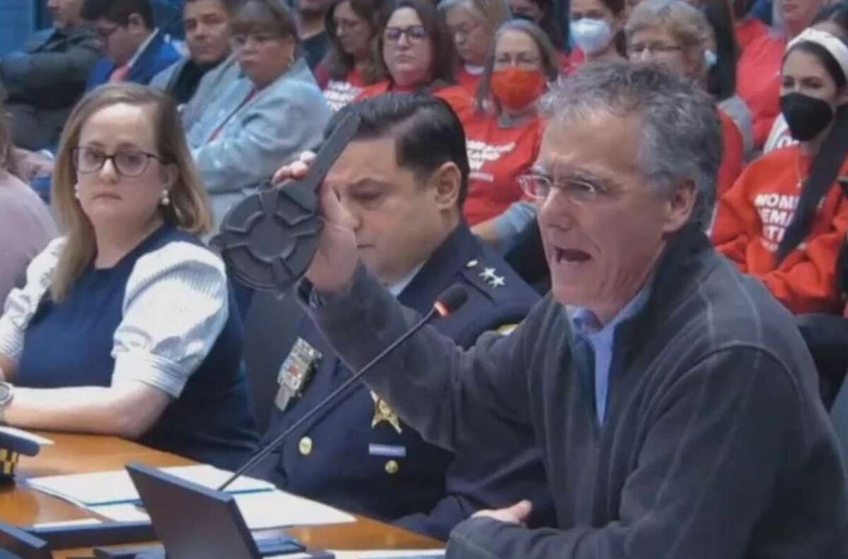 Cook County Sheriff Tom Dart (right) and other law enforcement officials testify before a House committee Tuesday as members consider a bill to ban high-power, high-capacity weapons in Illinois. 