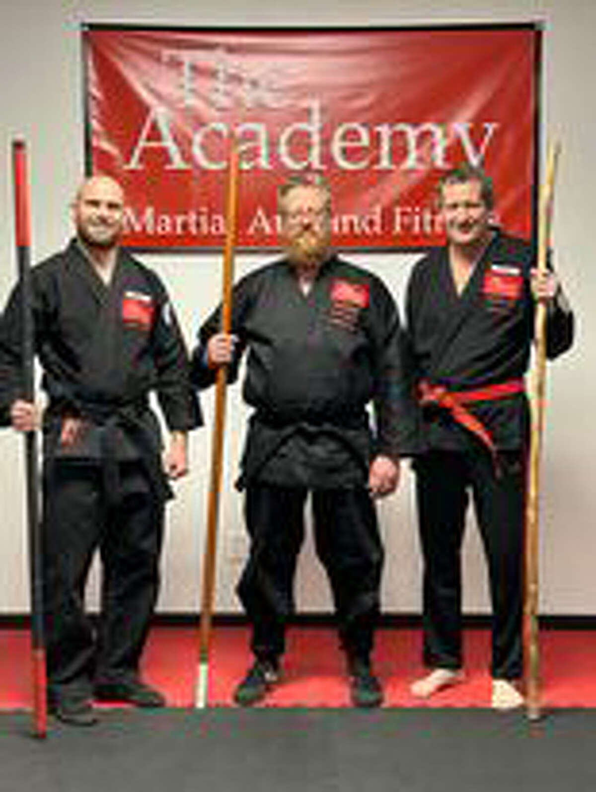 Pictured are (from left) The Academy instructor Jacob Sira, new black belt Josh Parsons, and instructor Craig Sira.
