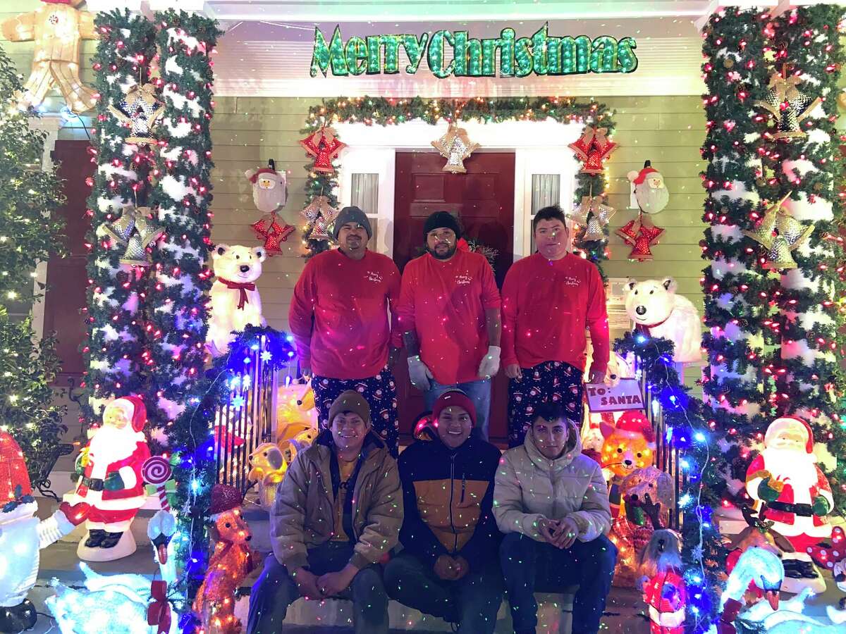Several people brave the cold everyday to help set up and take down Karen Cingari's Christmas decorations.