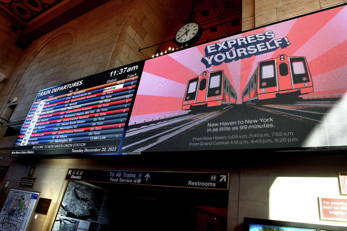 An electronic billboard displays information about Metro North Railroad express trains from New Haven to Grand Central Station at Union Station in New Haven on December 20, 2022.