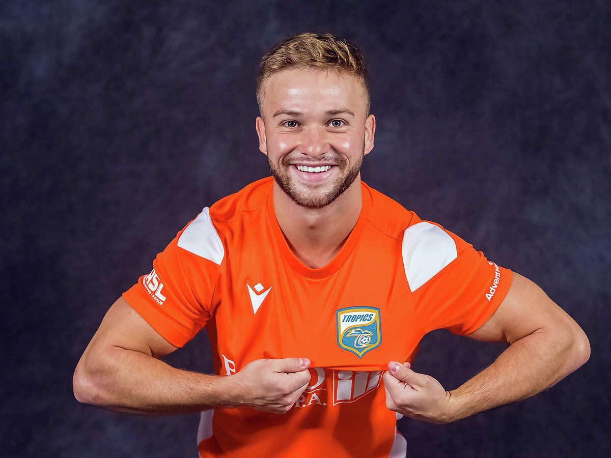 Skylar Funk shows off his new Florida Tropics jersey after he was drafted by the MASL team earler this month.