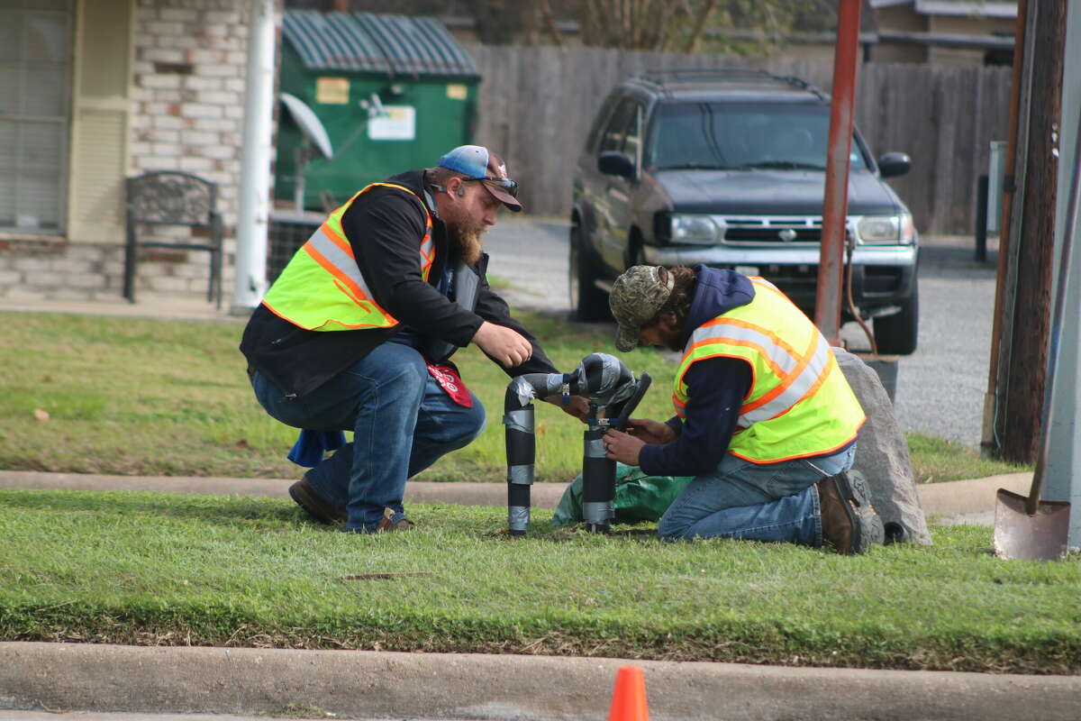 Deer Park city workers Matt Hicks and Stephen Olsen add new insulation to exposed pipes in the median of the 1900 block of Center St. on Wednesday. An official with a Houston plumbing company says residents are focusing more on preparing for this week's expected freeze than they were during Winter Storm Uri in 2021.