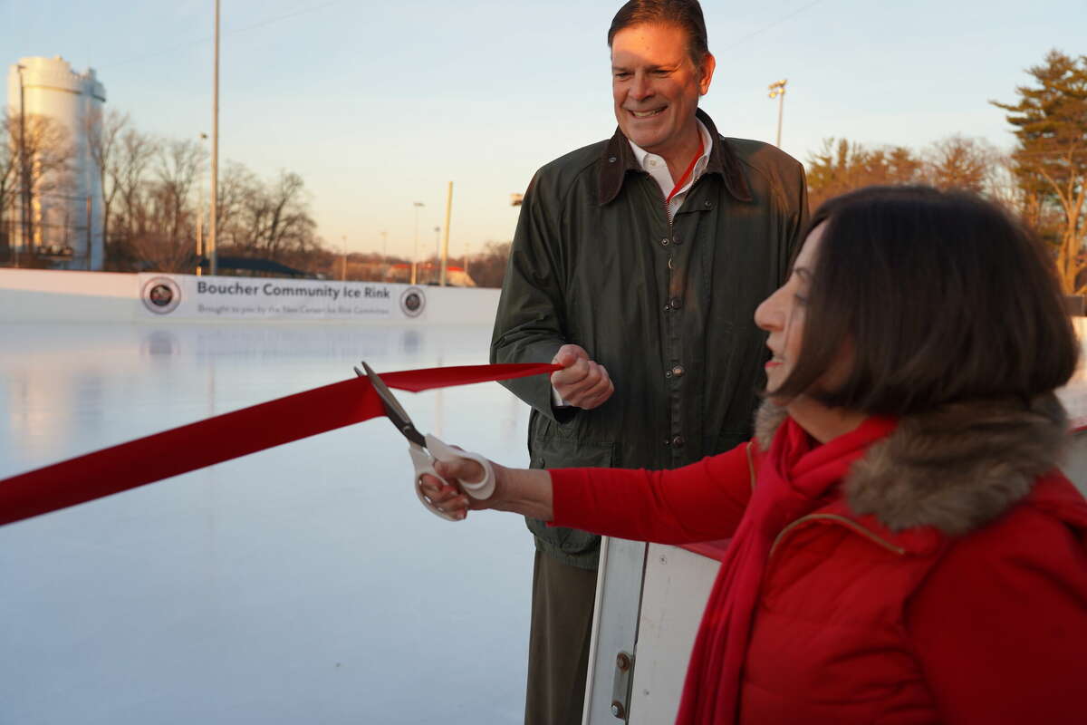 Toni Boucher cut the ribbon to open the Boucher Community Rink with Rep. Tom O'Dea watching on Dec. 21, 2022.