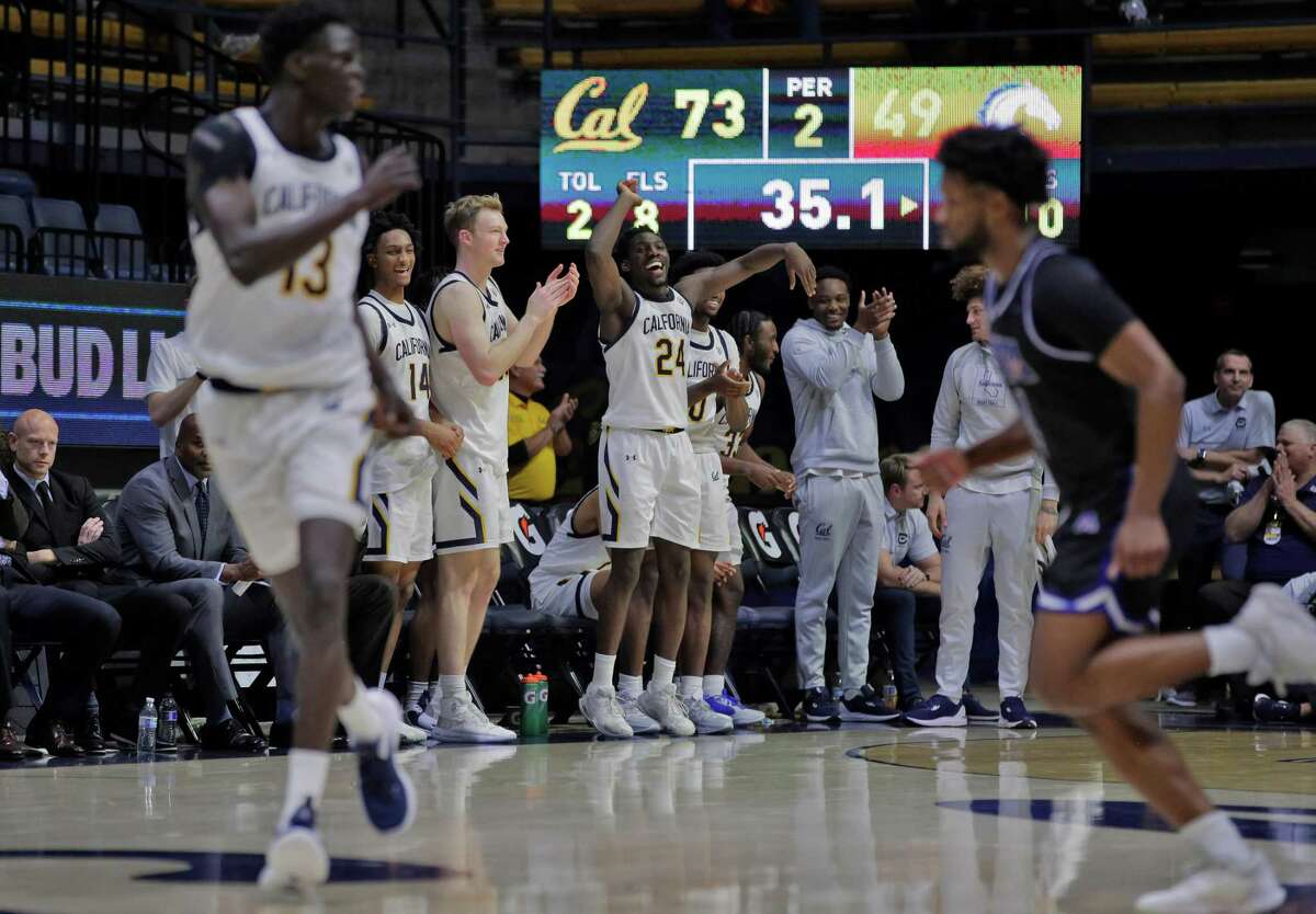 Cal’s bench celebrates in the final seconds of the game as the University or Californial at Berkeley Golden Bears played the University or Texas at Arlington Mavericks at Haas Pavilion in Berkeley, Calif., on Wednesday, December 21, 2022. The Golden Bears defeated the Mavericks 73-51 for their first win of the season.