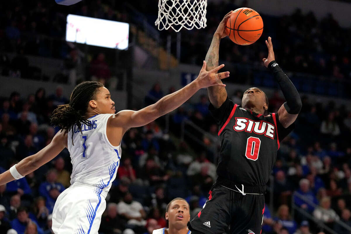 SIU-Edwardsville's Damarco Minor (0) heads to the basket as Saint Louis' Yuri Collins (1) defends during the first half of an NCAA college basketball game Wednesday, Dec. 21, 2022, in St. Louis. 