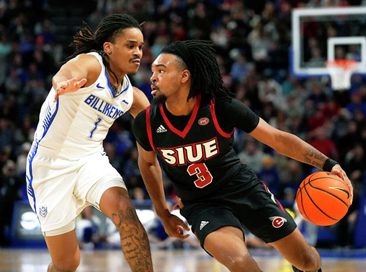 SIUE's Ray'Sean Taylor (3) drives on Saint Louis' Yuri Collins during the first half college basketball game Wednesday night in St. Louis.