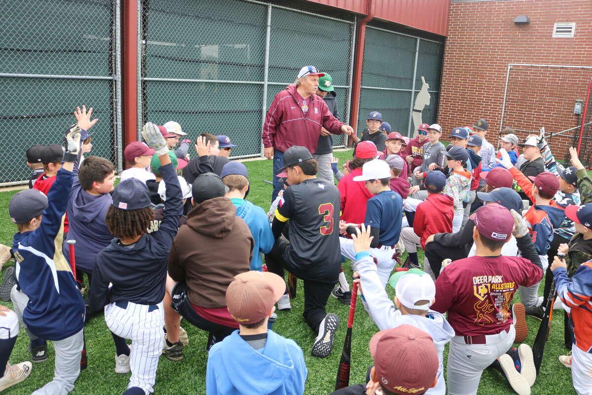 It's the first day of winter but you wouldn't know it with this crowd of baseball-loving children surrounding Deer Park head coach Chris Rupp during the two-day Holiday Baseball Camp. 
