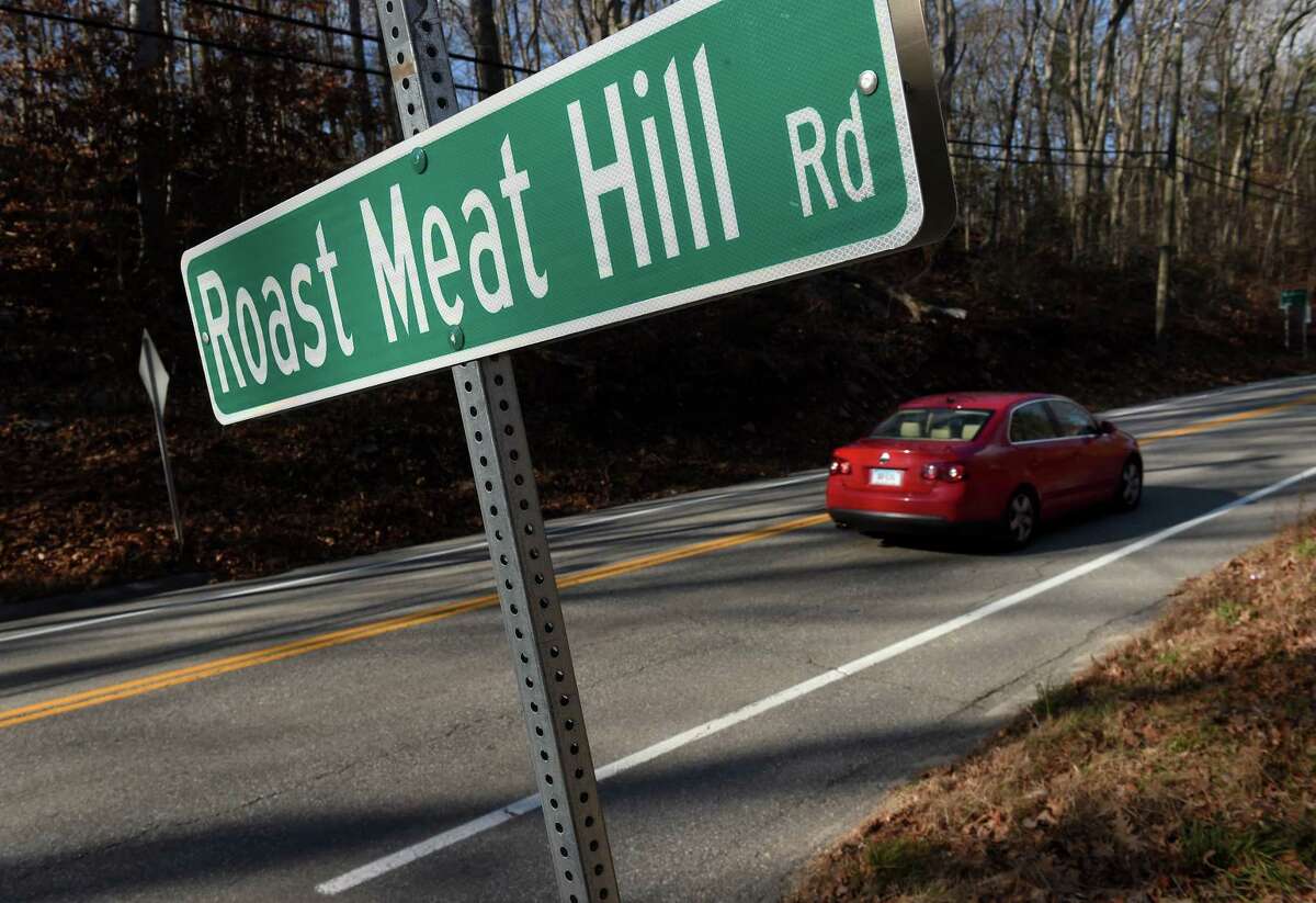 What's in a road name? PETA officials want to change the name of Roast Meat Hill Road in Killingworth. Cars pass the intersection of Roast Meat Hill Road and Route. 81 near the Clinton/Killingworth border.