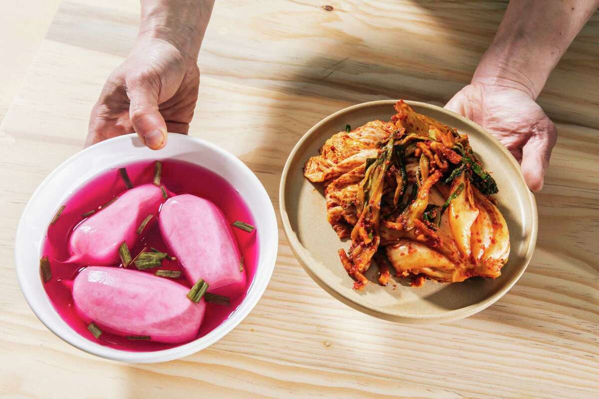 Dongchimi, left, and Napa cabbage kimchi photographed at Joodooboo in Oakland, California Tuesday, Jan. 11, 2022.