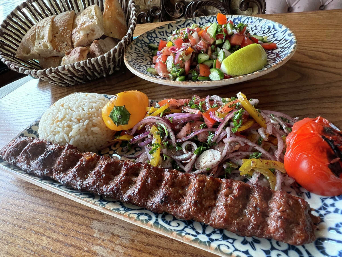 Adana kebab, foreground, from Chef's Table Turkish Mediterranean Grill is one of the Top 25 dishes of 2022.