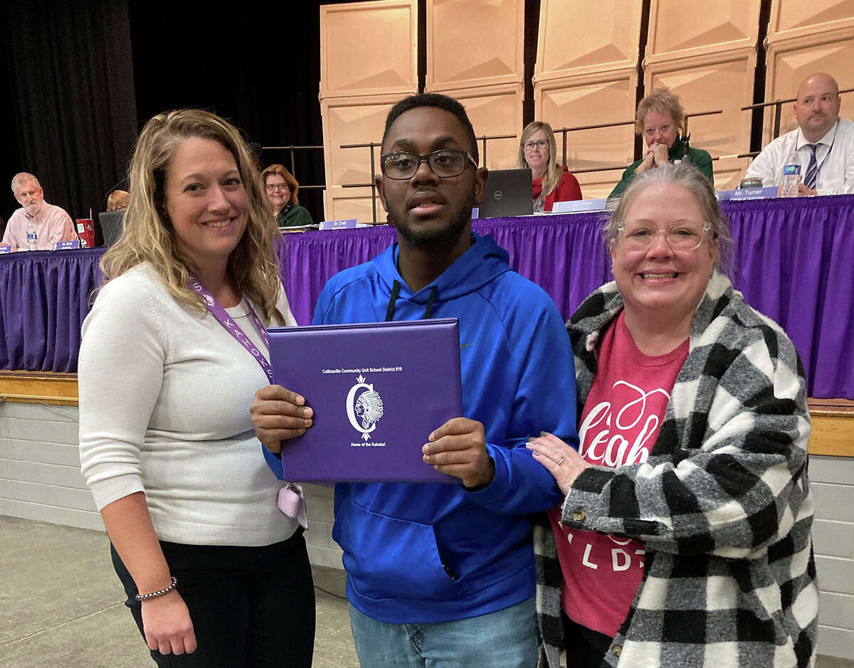 Special Education Supervisor Tara Glynn, left, and CHS Secondary Transitional Experience Program (STEP) coordinator, Catherine Kulupka, right, congratulate Keshawn Thomas, who holds his certificate of recognition from board president Gary Peccola and superintendent Dr. Mark B. Skertich.