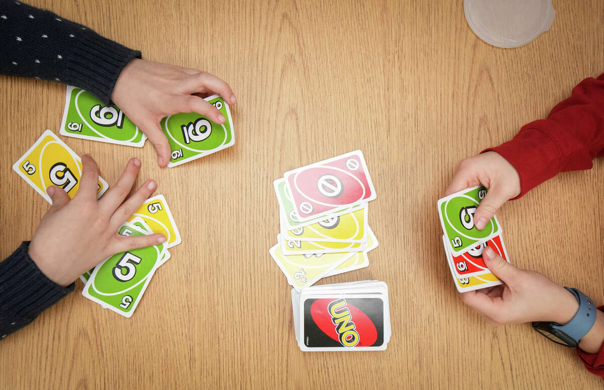 Two students play the card game "Uno" Wednesday, Dec. 21, 2022, at the Dyslexia School of Houston in West University Place.