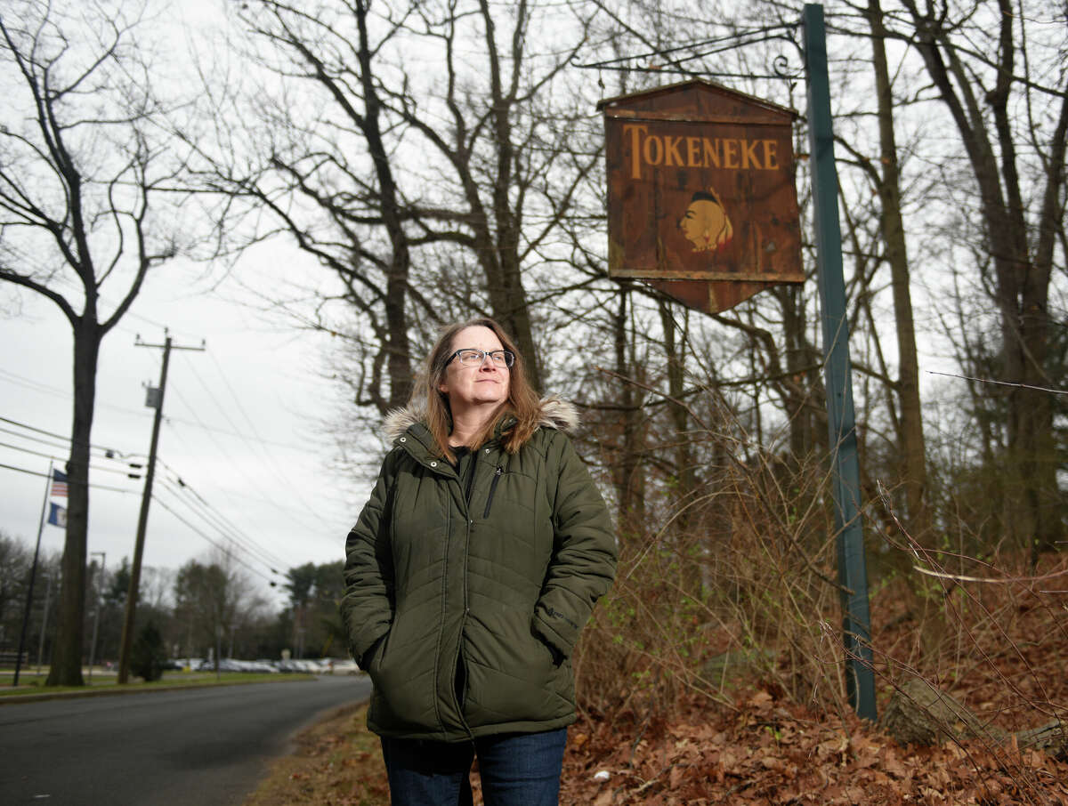 Former Tokeneke Elementary School cafeteria worker Vanessa David poses by Tokeneke Elementary School in Darien, Conn. Thursday, Dec. 22, 2022.