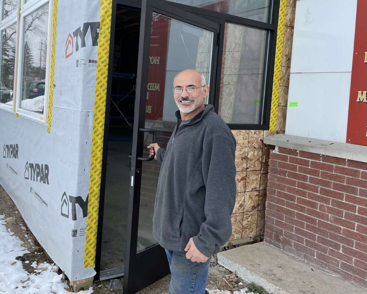 J&A Grocery owner Samir Angious standing outside the new dining room currently being constructed at his store.