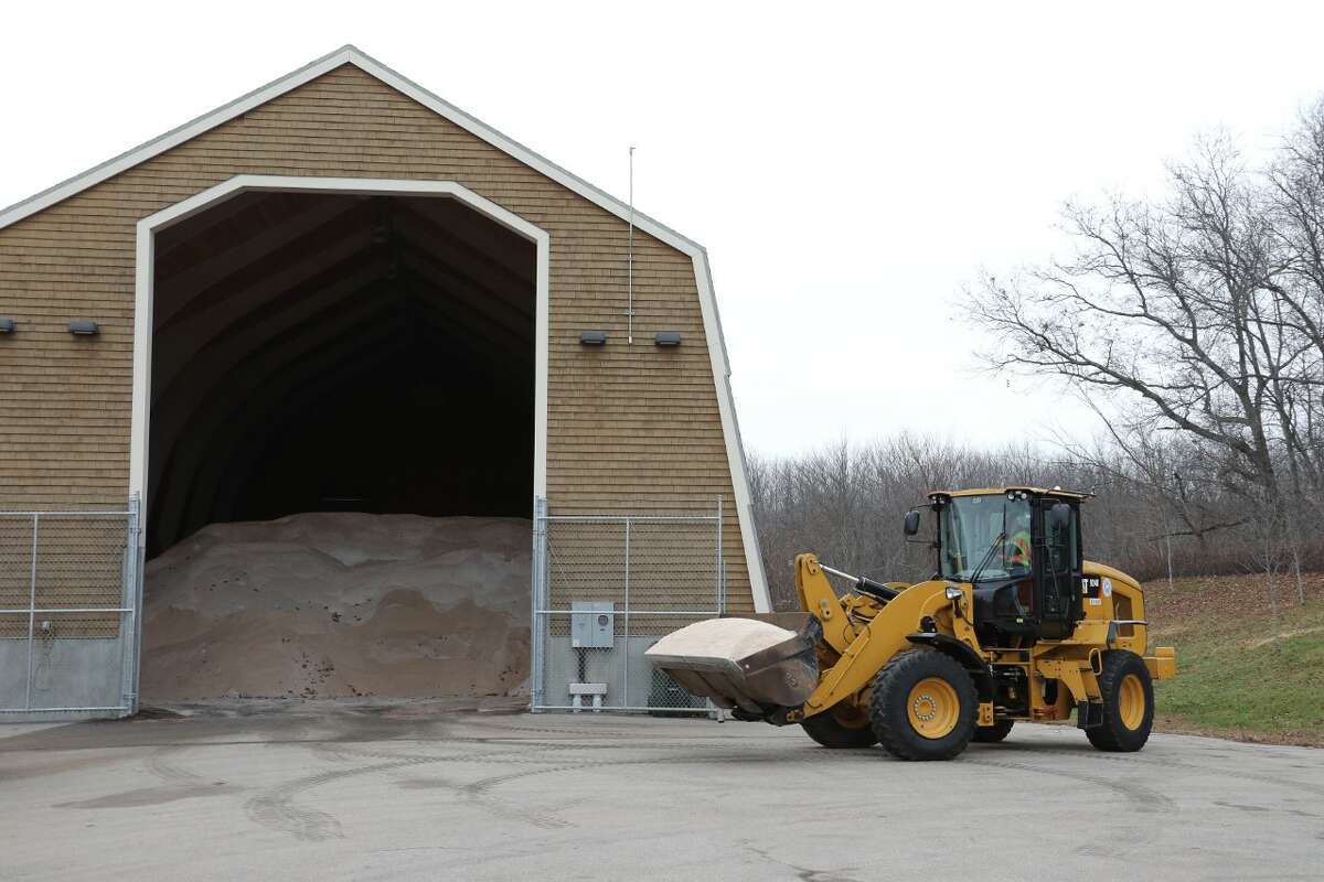 Crews with Connecticut Department of Transportation load salt in anticipation of a winter storm.