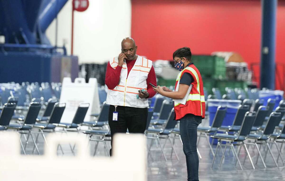 Health Dept. employees enactment    astatine  the George R. Brown Convention Center earlier  it is opened up   for a warming presumption    connected  Thursday, Dec. 22, 2022 successful  Houston. The metropolis  plans to support  the warming center, which has chairs, nary  cots, unfastened  until Saturday.