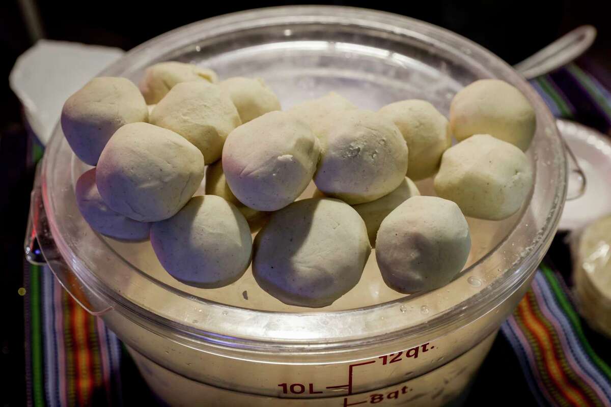 Balls of dough for tortillas can be seen at the food stand Shucos Magi, owned and operated by Maria Rodas, known as Magi, and her family in Fruitvale in Oakland, Calif. on Wednesday, Dec. 21, 2022.