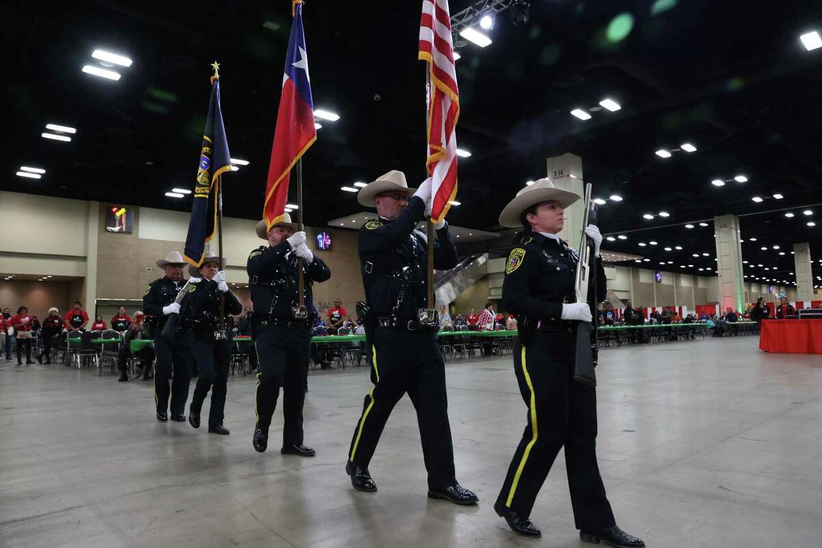The Bexar County Sheriff’s Honor Guard presents the colors at the start of the annual H-E-B Feast of Sharing at the Henry B. Gonzalez Convention Center, Thursday, Dec. 22, 2022. The event is one of 34 feasts hosted by H-E-B in Texas and Mexico. More that 250,000 meals were expected to be served at the feasts. In San Antonio, people were treated to smoke brisket and sausage dinners along with dessert and treats.