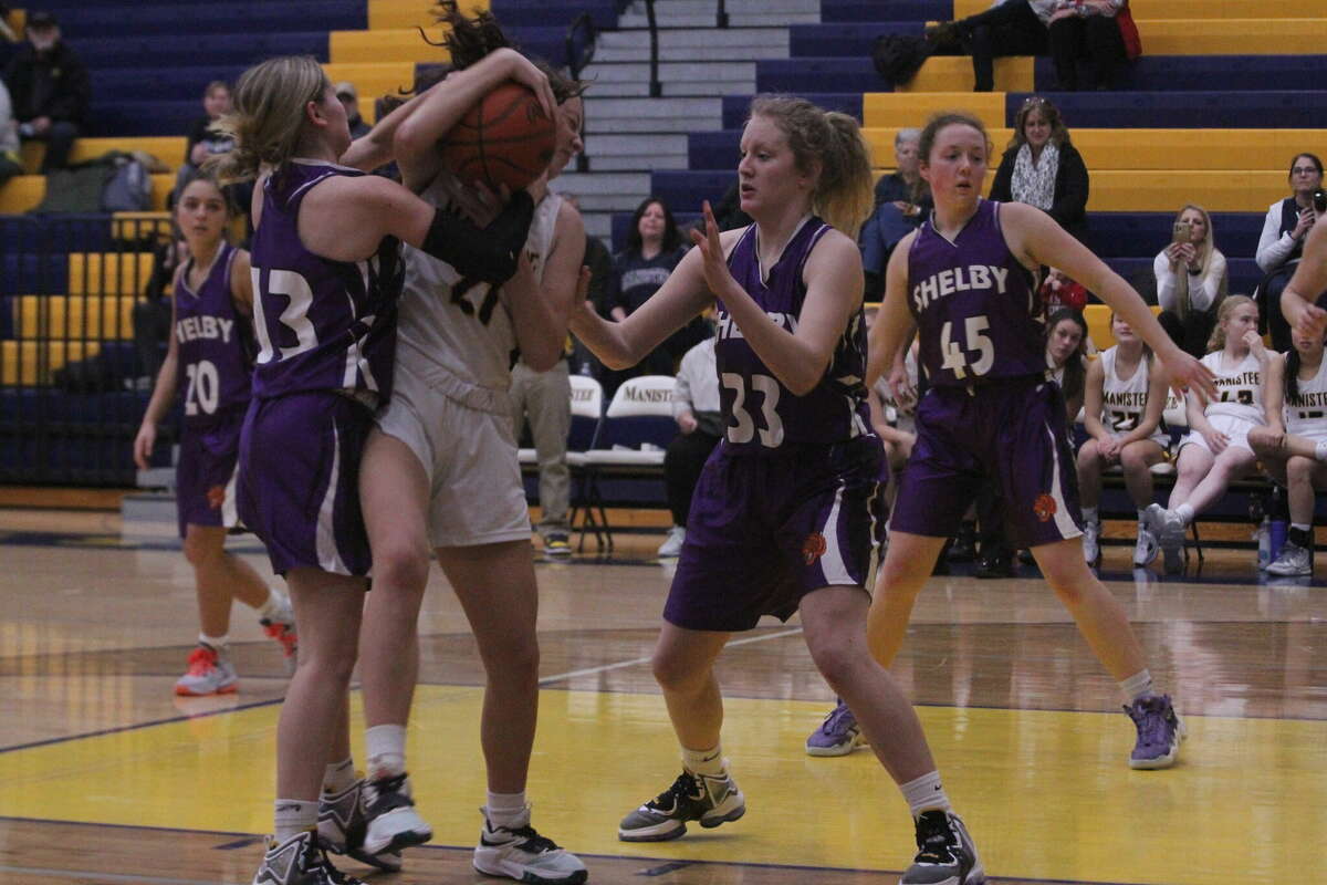 Manistee's Abby Robinson grabs a rebound against Shelby on Dec. 22.