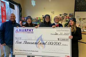 New Milford firm surprises deli worker with check for holidays