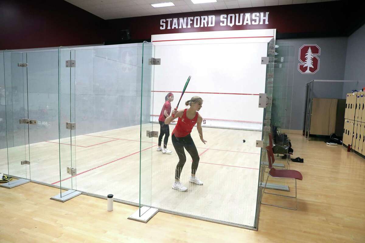 Stanford women’s squash co-captains Si Yi Ma (left) and Lucia Bicknell practice earlier this month. Squash and 10 other sports were reinstated last year after losing sponsorship in 2020.