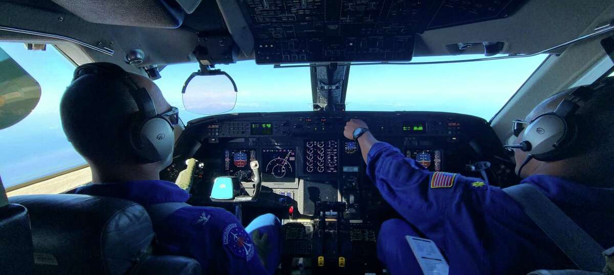 Capt. Jason Mansour, the aircraft commander, and Lt. Cmdr. Rick DeTriquet at the controls of NOAA’s Gulfstream IV during an atmospheric river mission.