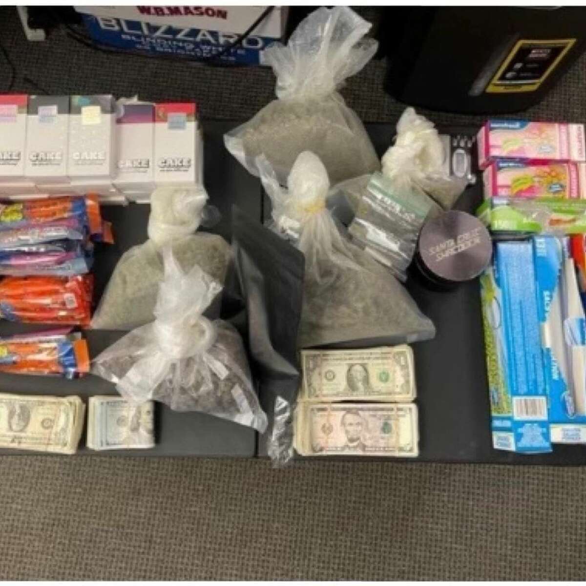 Two people were arrested Wednesday after multiple searches turned up drugs, fake IDs, narcotics paraphernalia and other illegal items, according to Norwalk police.