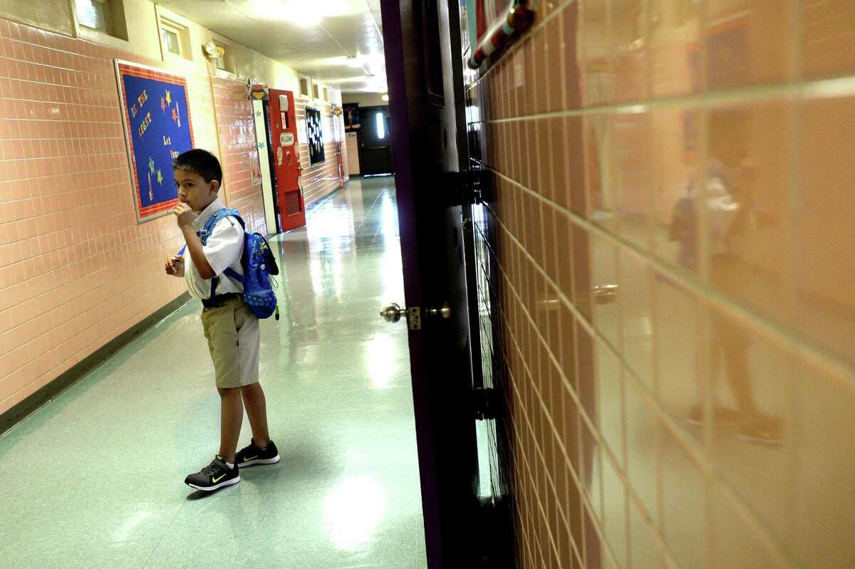 A student at a Catholic school in Beaumont heads to class. One reader doesn’t want property taxes to support private, religious or home-schooled education.