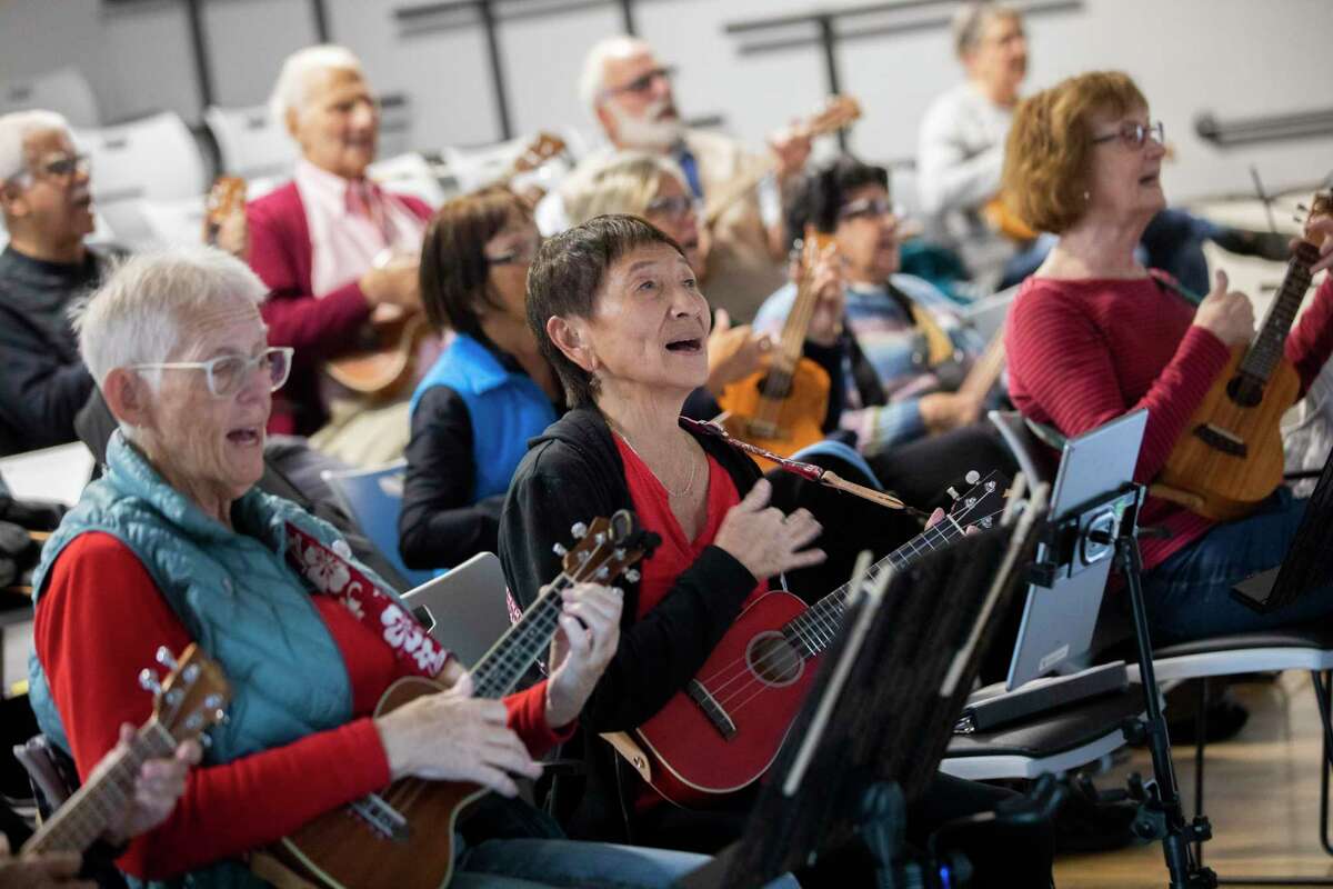 Nancyj Moran (left), Aki Rasmussen and Jean Howard play the ukulele at the Rossmoor retirement community in Walnut Creek.