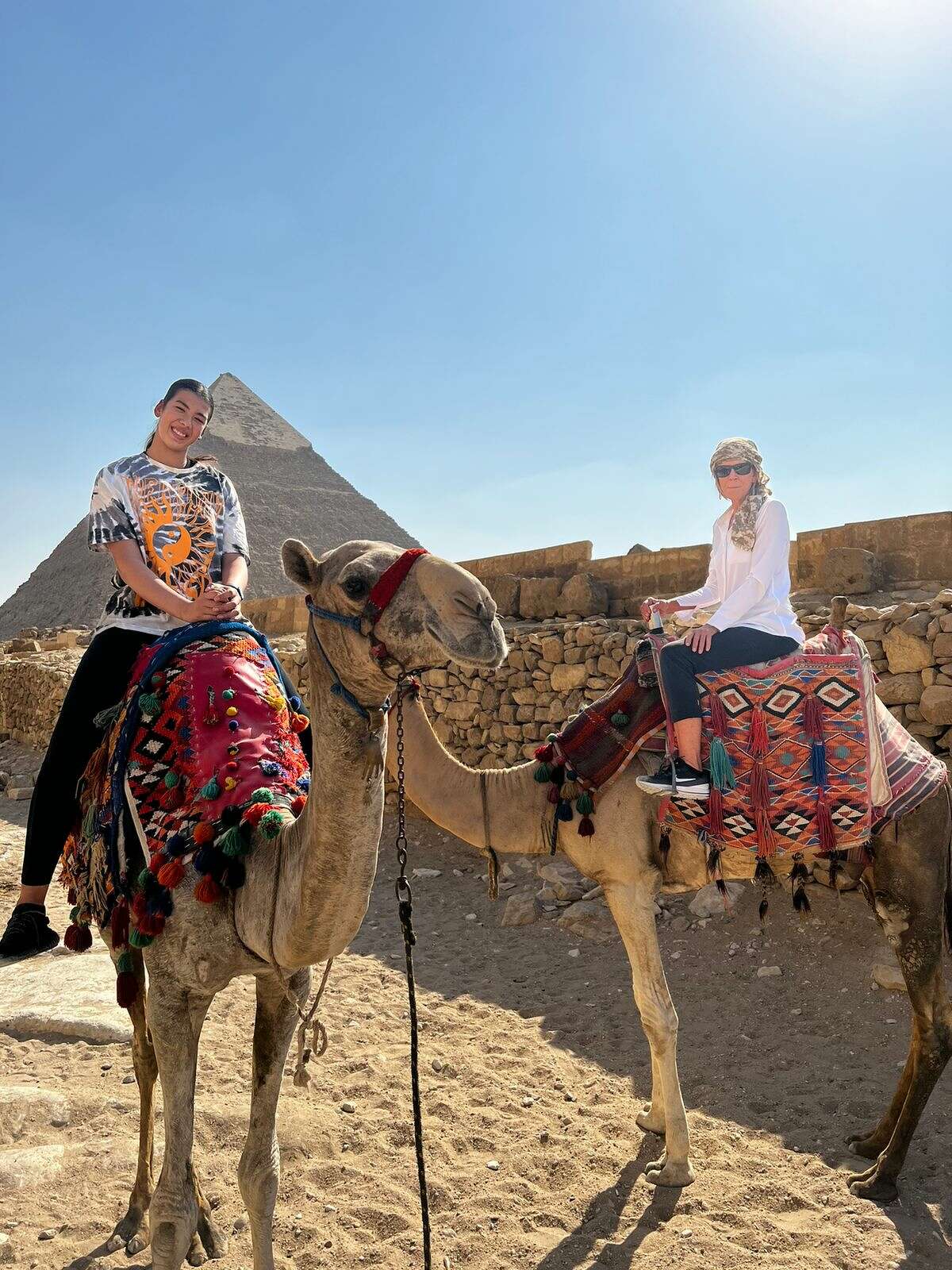 UConn women's basketball associate head coach Chris Dailey visited Jana El Alfy in Egypt. El Alfy gave Dailey a tour of the Pyramids and the two also rode camels together.