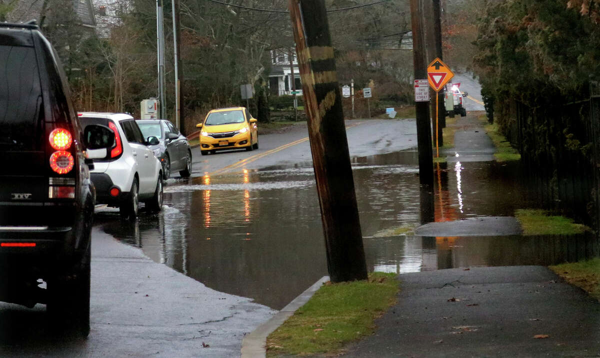 Remnants of flooding left behind along West End Ave in Greenwich, Conn., on Friday December 23, 2022.