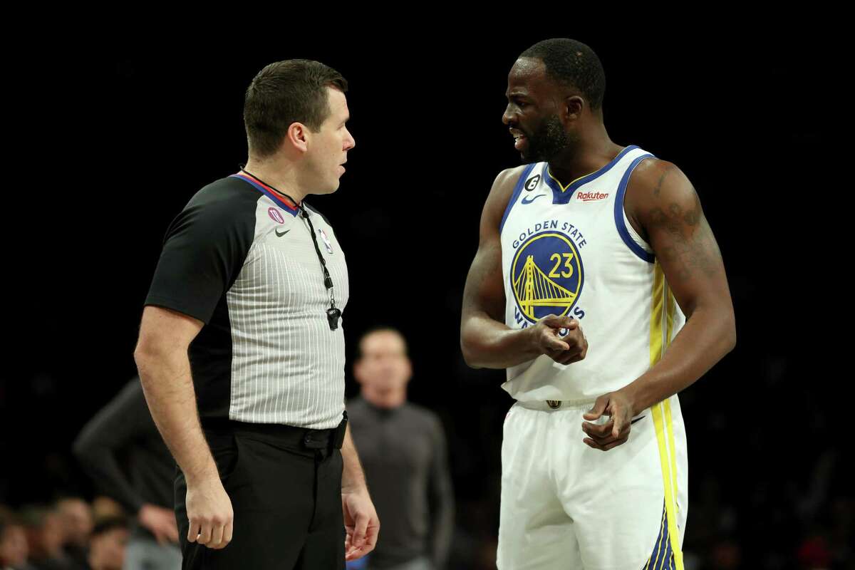 NEW YORK, NEW YORK - DECEMBER 21: Draymond Green #23 of the Golden State Warriors argues with referee Matt Kallio #88 against the Brooklyn Nets during the first half of the game at Barclays Center on December 21, 2022 in the Brooklyn borough of New York City. NOTE TO USER: User expressly acknowledges and agrees that, by downloading and or using this photograph, User is consenting to the terms and conditions of the Getty Images License Agreement. (Photo by Sarah Stier/Getty Images)