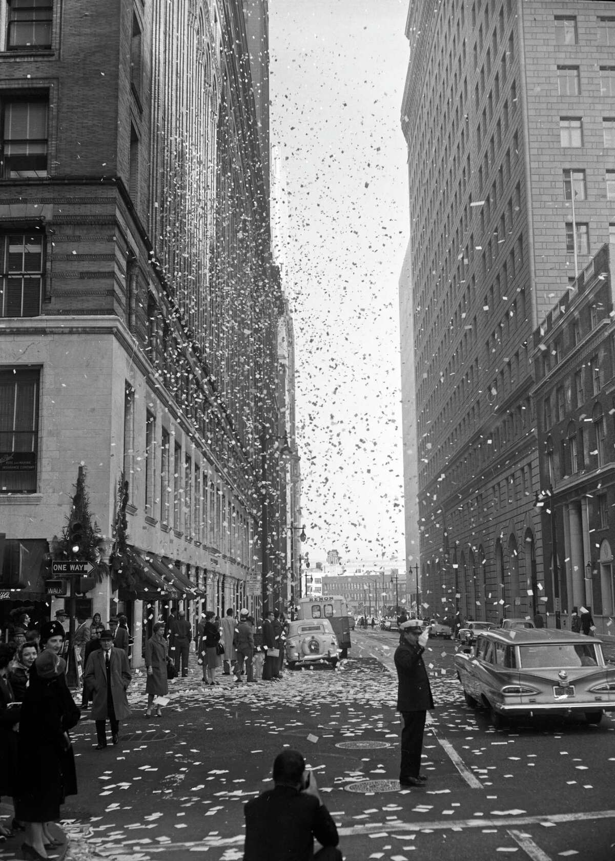 Dec. 31, 1960: Refuse sits on Montgomery and Bush streets after office workers threw calendar pages and other paper outside their windows in San Francisco's Financial District.