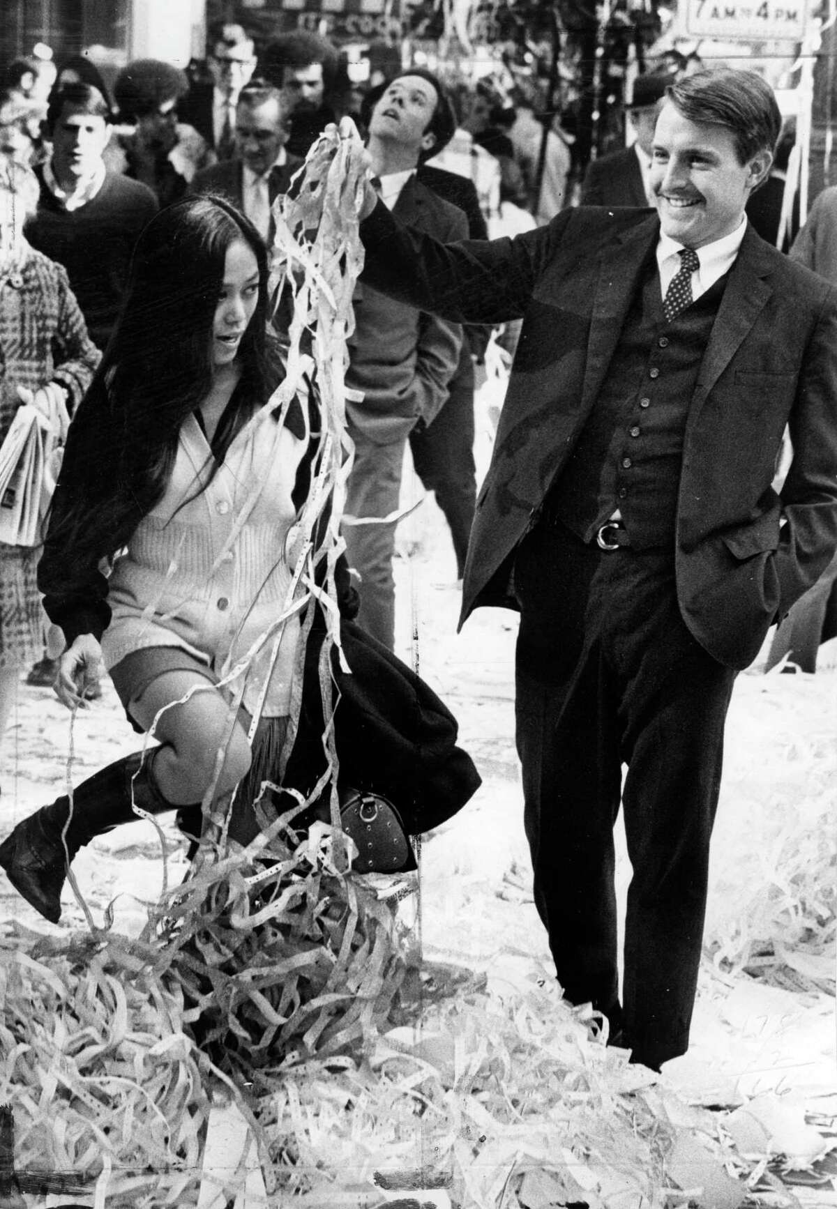 Dec. 31, 1969: Imelda Segismund and Kent Knudtson wade through paper thrown out of downtown San Francisco office windows on the last work day of the year.