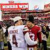 San Francisco 49ers quarterback Brock Purdy (13) speaks with Washington Commanders quarterback Taylor Heinicke (4) after their NFL football game in Santa Clara, Calif., Saturday, Dec. 24, 2022. The 49ers defeated the Commanders 37-20.