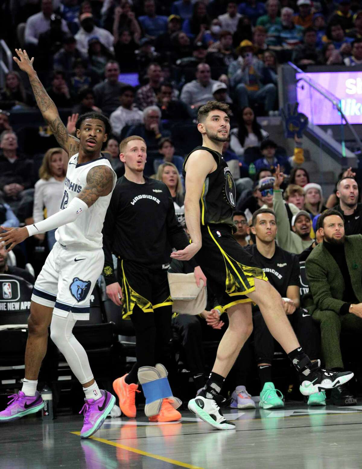 Ty Jerome (10) watches his three point shot go in In the second half as the Golden State Warriors played the Memphis Grizzlies at Chase Center in San Francisco, Calif., on Sunday, December 25, 2022.