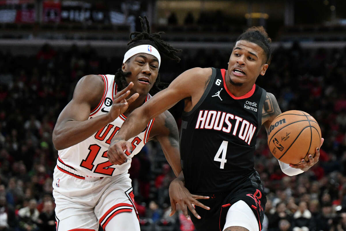 Houston Rockets guard Jalen Green (4) drives to the basket against Chicago Bulls guard Ayo Dosunmu (12) during the first half of an NBA basketball game Monday, Dec. 26, 2022, in Chicago. (AP Photo/Quinn Harris)