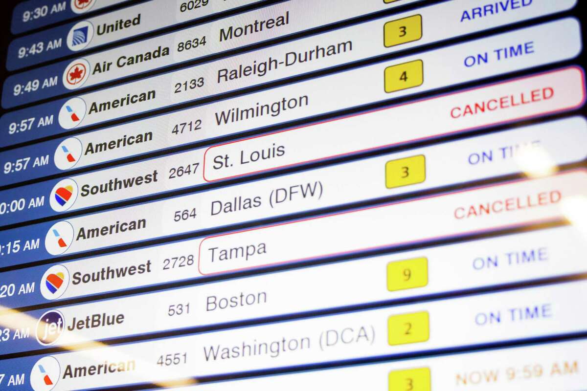 Cancelled Southwest Airlines flights are seen on the flight schedules at LaGuardia Airport, Tuesday, Dec. 27, 2022, in New York. The U.S. Department of Transportation says it will look into flight cancellations by Southwest that have left travelers stranded at airports across the country amid an intense winter storm. (AP Photo/Yuki Iwamura)