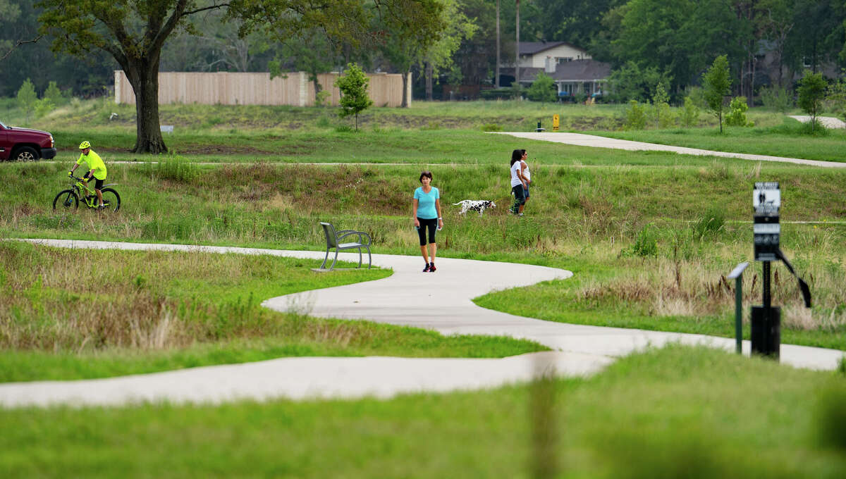 People enjoy Exploration Green, a park created on a former golf course and built in phases in Clear Lake.