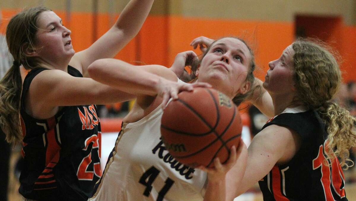 Action from the Routt girls' basketball team's loss to Macomb in the second round of the Beardstown Lady Tiger Classic on Monday