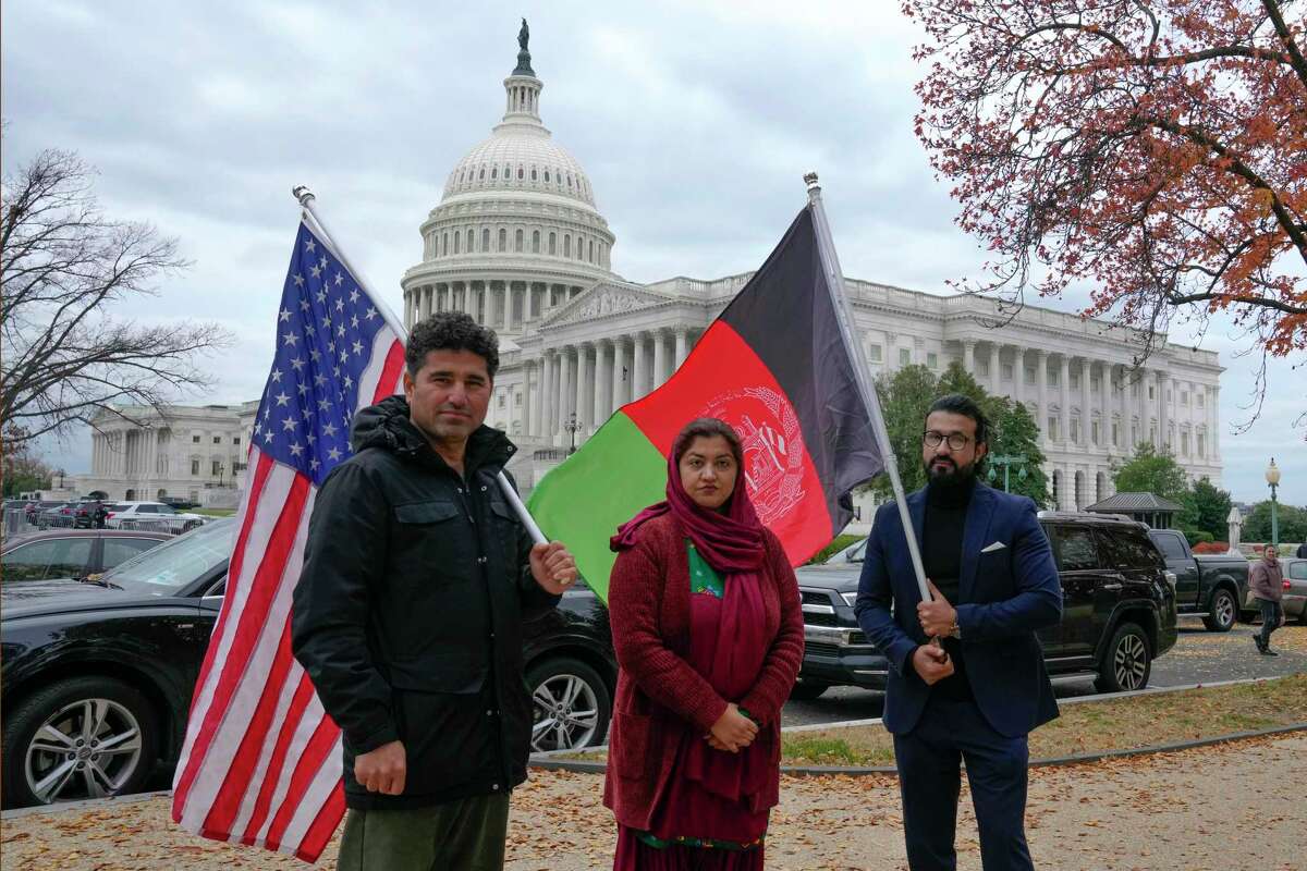 Demonstrators gather to support new Afghan immigrants, outside of the Capitol earlier this month. Congress failed to include the Afghan Adjustment Act in the omnibus spending bill, making the future uncertain for Afghans who fled the Taliban.