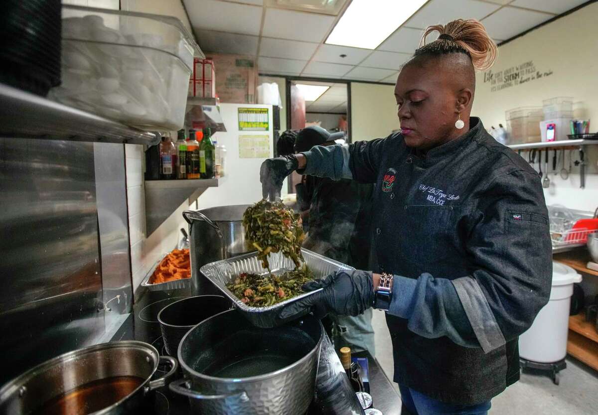 LaToya Larkin, chef and owner of Black Girl Tamales dishes out collard greens for her tamales.