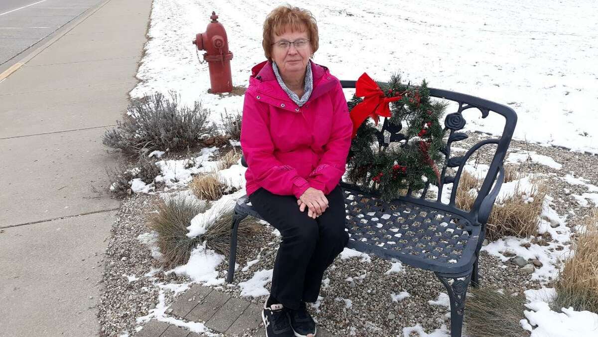 Roxy Smith recently at a bench presented to her some years ago near the Coleman Area Library.