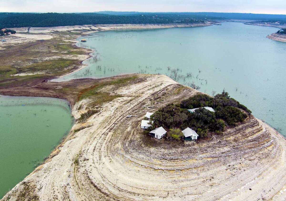 Medina Lake’s iconic Tiki Island, seen Dec. 21, 2022, is now a peninsula as the lake stands at 6.5 percent full. The lake, now more than 79 feet below full, is the lowest it has been since 2015.
