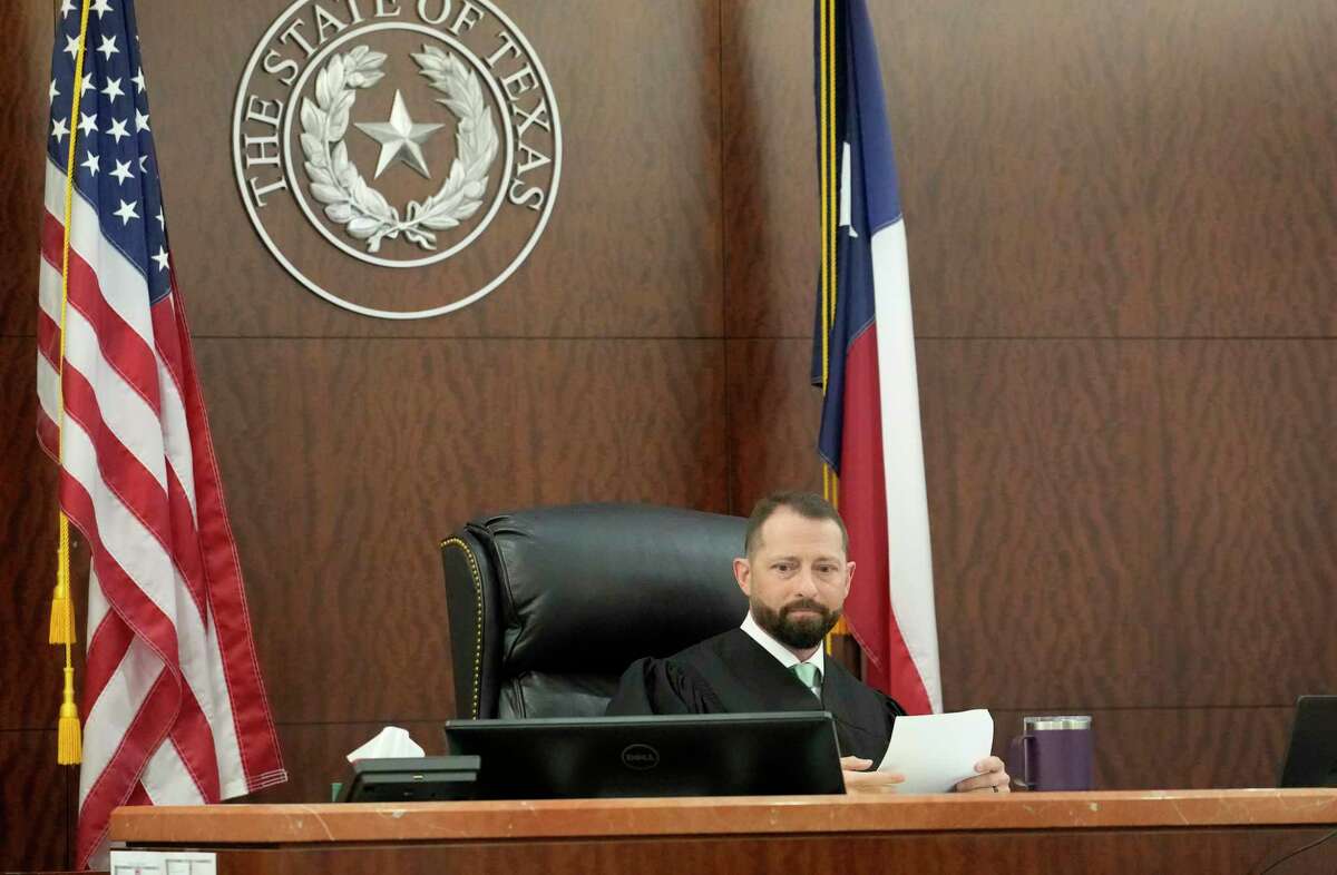 Judge Josh Hill is shown as he holds a Zoom call with lawyers in the 232nd District Court as he explains his decision that Patrick Clark, 33, accused of killing Migos rapper Takeoff will remain held on a $1 million bond Wednesday, Dec. 28, 2022, in Houston. Clark has been jailed since Dec. 1 on a murder charge in connection with the fatal shooting of Takeoff, whose real name was Kirsnick Khari Bell.